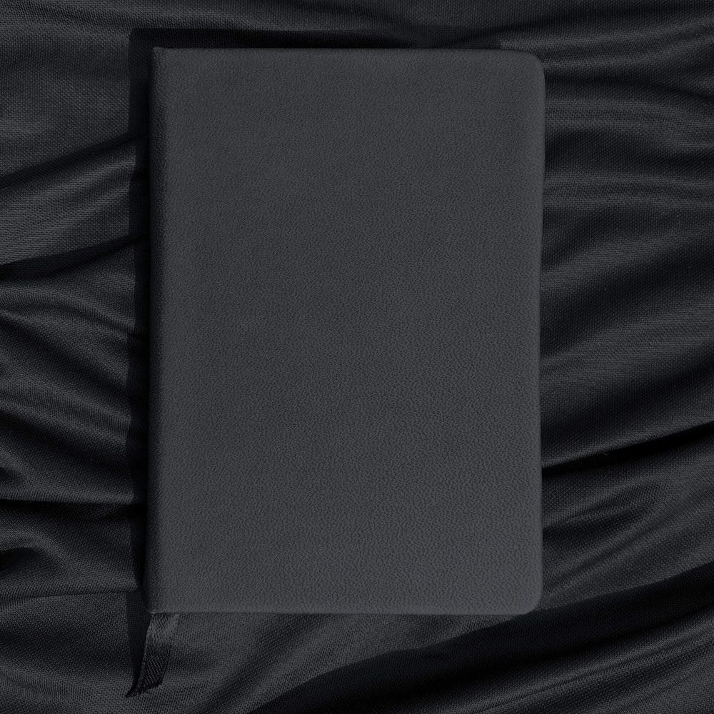 Black Notebook with Silver Pen